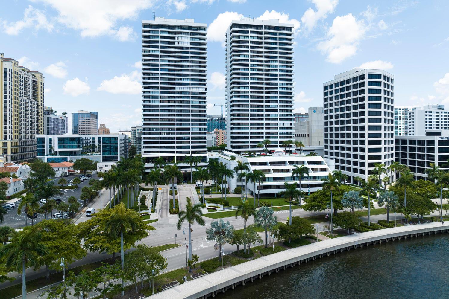 An aerial view of two tall residential towers and a mid-rise office building near water — 525 S Flagler Drive, West Palm Beach FL 33401, WEST PALM BEACH, FL