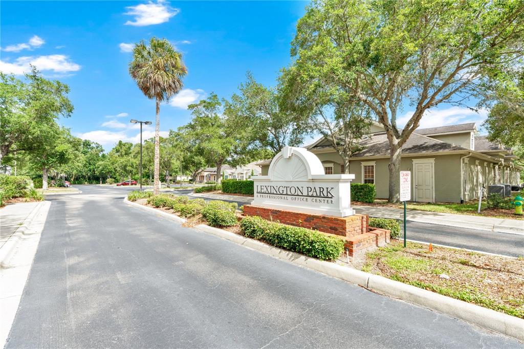 The entrance to Lexington Park Professional Office Center features a brick sign and landscaping — 1300 LEXINGTON GREEN LANE, SANFORD, FL