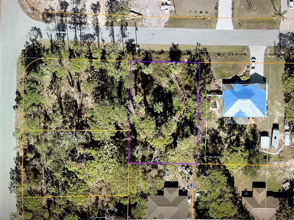This is an aerial map showing a vacant, wooded residential lot outlined in purple — LOT 4 RED COACH AVENUE, NORTH PORT, FL
