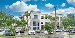 A multi-story commercial office building with palm trees and a parking lot in front — 7950 NW 53rd St # 308, Doral FL 33166, DORAL, FL