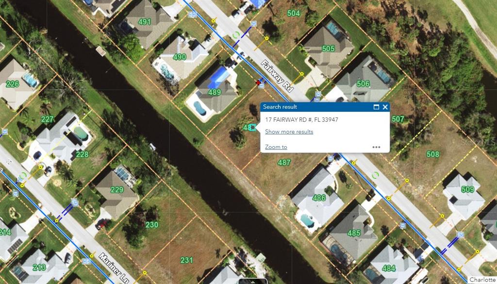 This is an aerial map showing residential properties along a canal and street — 17 FAIRWAY ROAD, ROTONDA WEST, FL