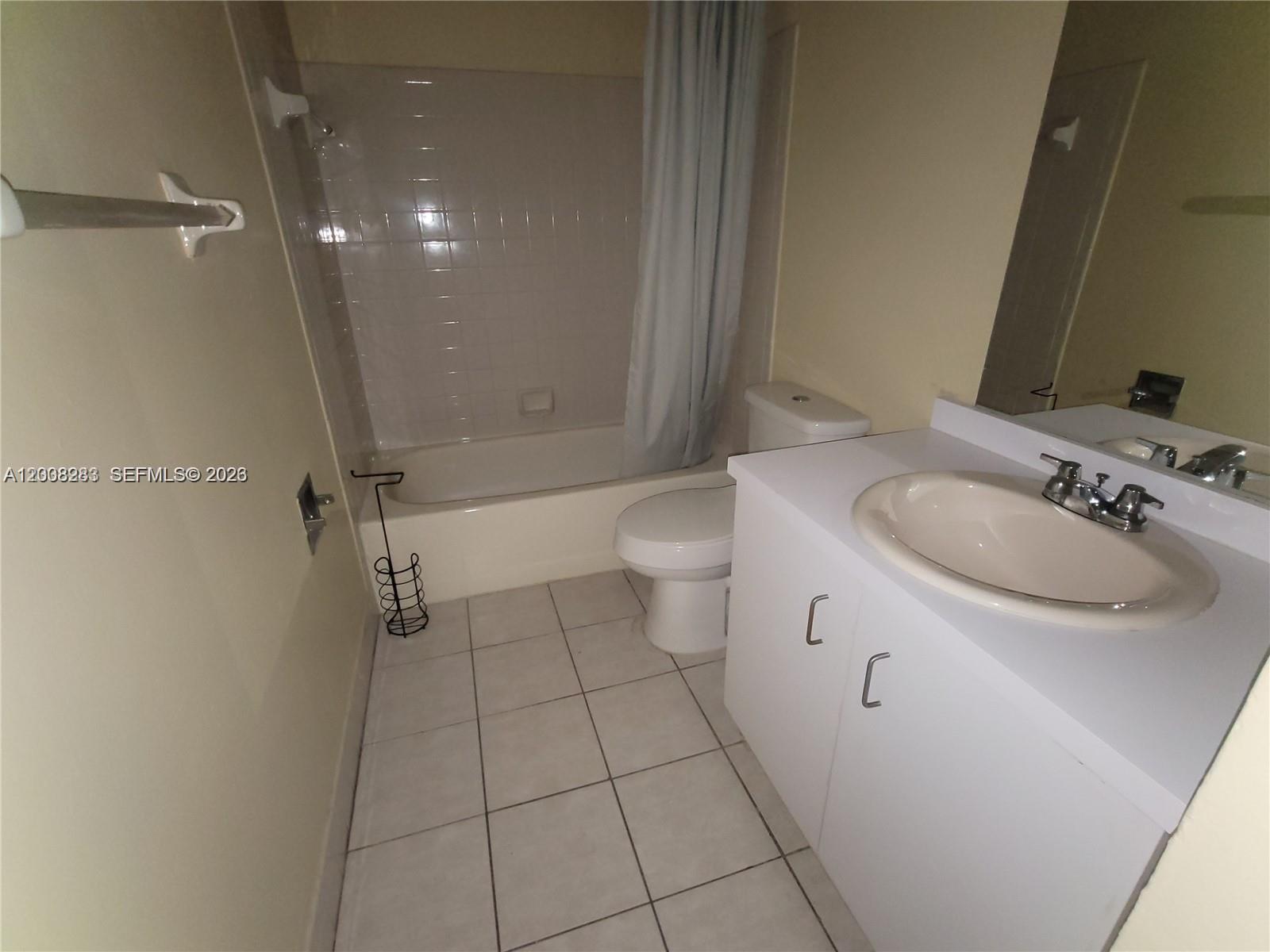 This bathroom features a white vanity, a toilet, and a shower-tub combination with tile walls — 6948 SW 36th Ct # Z, Miramar FL 33023, MIRAMAR, FL