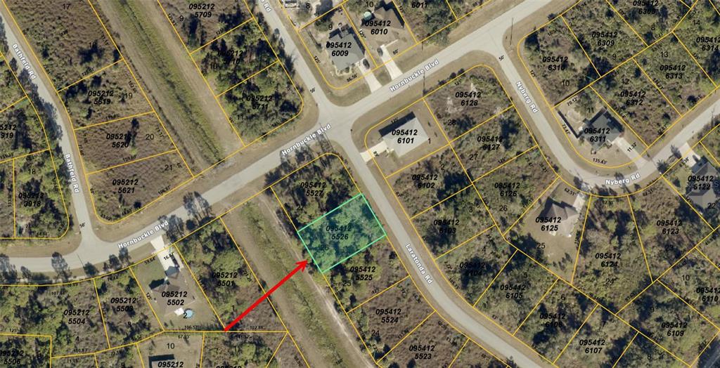 This is an aerial map showing a highlighted vacant lot at a street intersection — LARATONDA ROAD, NORTH PORT, FL