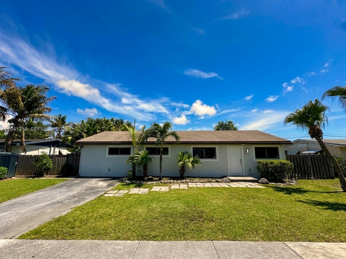 A single-story house with a light-colored exterior, a brown roof, and a front lawn — 10015 SW 213th Ter, Cutler Bay FL 33189, CUTLER BAY, FL