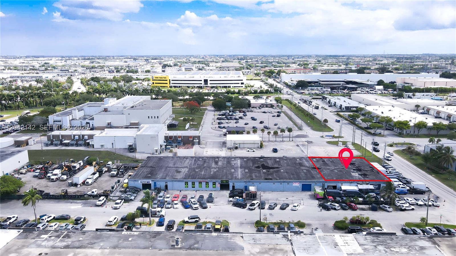An aerial view shows a large industrial warehouse building with a marked rooftop section — 5500 NW 74th Ave, Miami FL 33166, MIAMI, FL