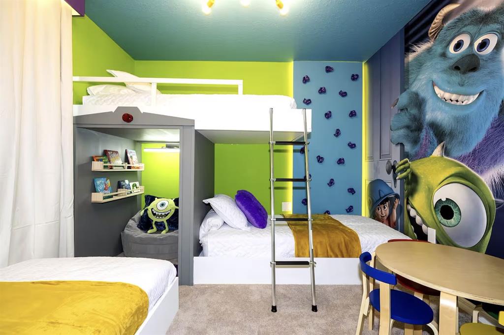 A themed bedroom features a bunk bed, a climbing wall, and Monsters, Inc. wall murals — 4294 LANA AVENUE, DAVENPORT, FL