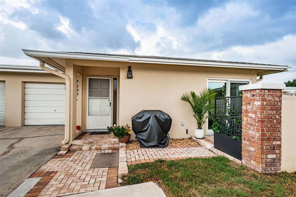 This is a floor plan for a one-bedroom home with a garage and living area — 2735 SHERBROOKE LANE UNIT C, PALM HARBOR, FL