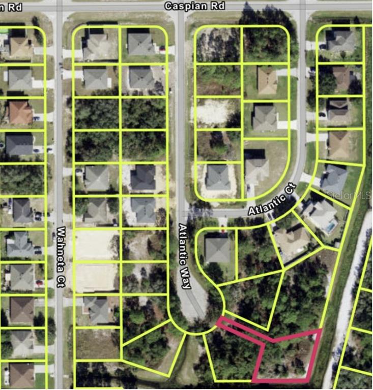 An aerial map shows a residential neighborhood with a highlighted vacant lot at the end — 1223 ATLANTIC WAY, KISSIMMEE, FL