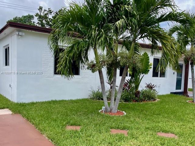 A white single-story house with a palm tree in the front yard — 330 W 40th Pl, Hialeah FL 33012, HIALEAH, FL