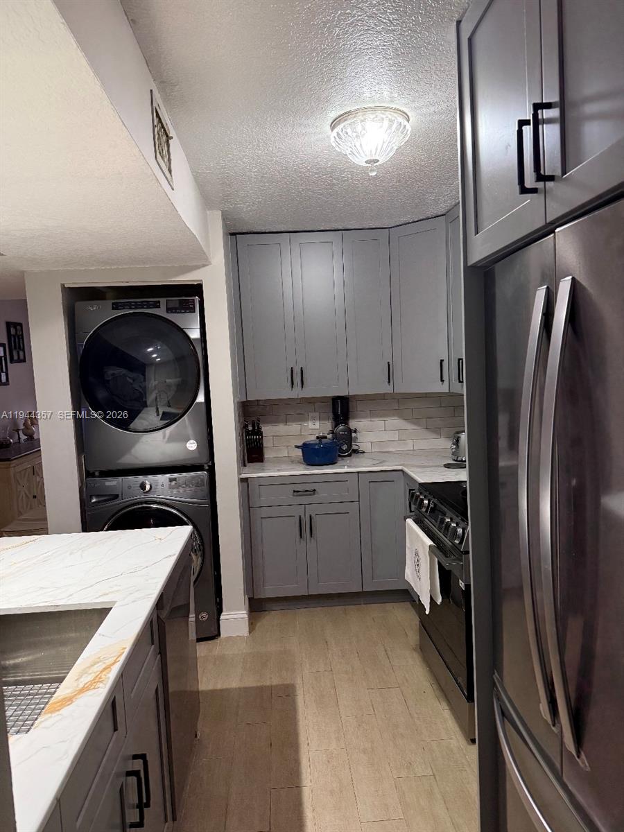 A landing area features wood-look tile flooring, a window, a closet, and a staircase — 8019 NW 15th Mnr # 8019, Plantation FL 33322, PLANTATION, FL