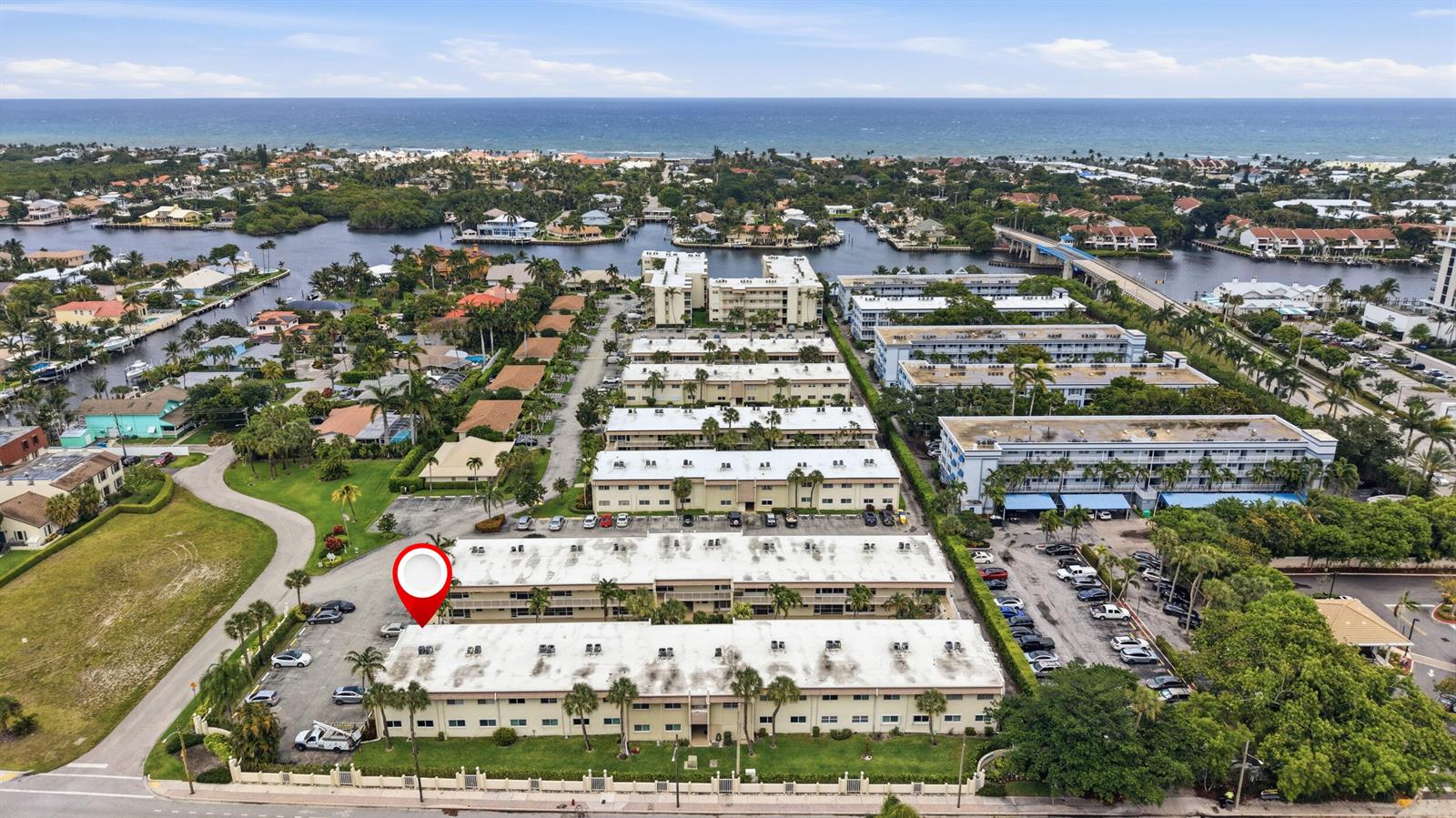 An aerial view shows a multi-story apartment complex with a red location pin — 600 Snug Harbor Drive # A10, Boynton Beach FL 33435, BOYNTON BEACH, FL