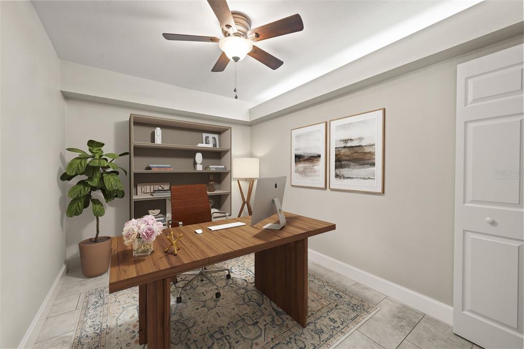 This is a digital rendering of a home office featuring a desk, shelving, and decor — 4910 COUGAR COURT N UNIT 103, NAPLES, FL