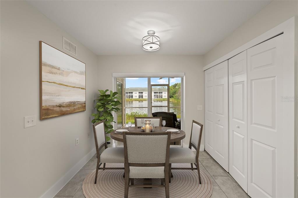 A dining area features a round table, four chairs, a light fixture, and sliding glass doors — 4910 COUGAR COURT N UNIT 103, NAPLES, FL