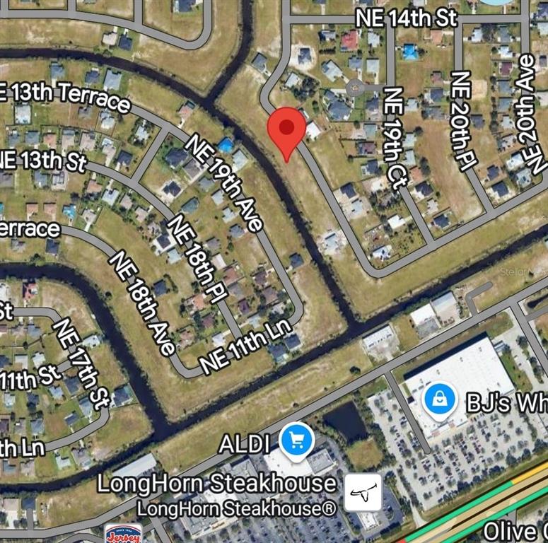 This is a map showing a residential area with a red pin marking a property — 1302 NE 19TH PLACE, CAPE CORAL, FL