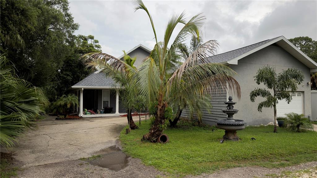A screened-in patio features a swimming pool, a hot tub, and brick pavers — 6451 76TH TERRACE N, PINELLAS PARK, FL