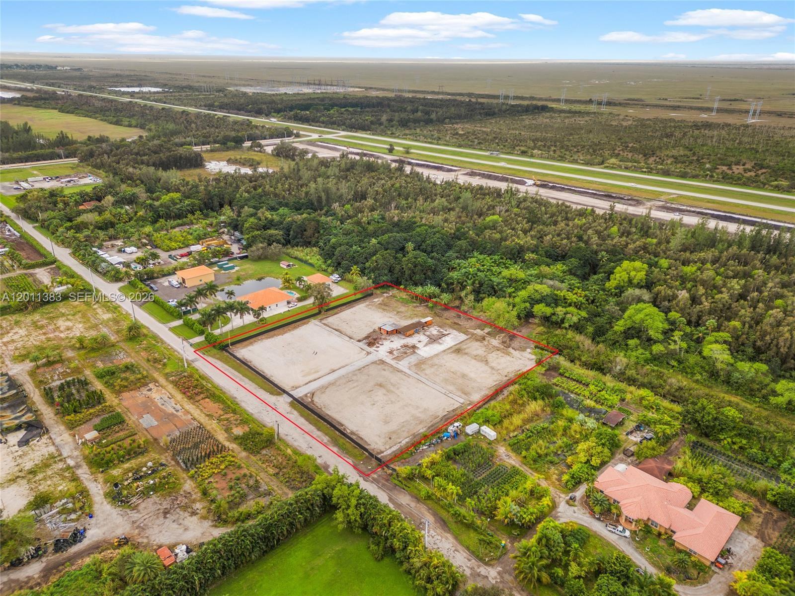 An aerial view shows a cleared, rectangular lot outlined in red with a small structure — 5601 SW 210th Ter, Southwest Ranches FL 33332, SOUTHWEST RANCHES, FL