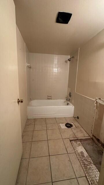A bathroom features a white bathtub, tiled flooring, and an exposed toilet flange — 3162 N Pine Island Road, Sunrise FL 33351, SUNRISE, FL