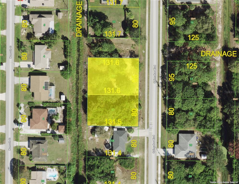 This is a satellite map showing residential lots and property boundaries in a suburban neighborhood — 7221 and 7229 SPINNAKER BOULEVARD, ENGLEWOOD, FL
