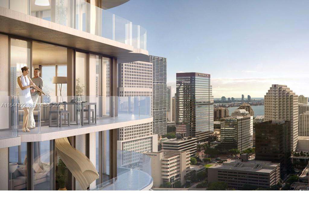 This is a rendering of a high-rise balcony overlooking a city skyline and waterfront — 45 SW 9th St # 1005, Miami FL 33130, MIAMI, FL