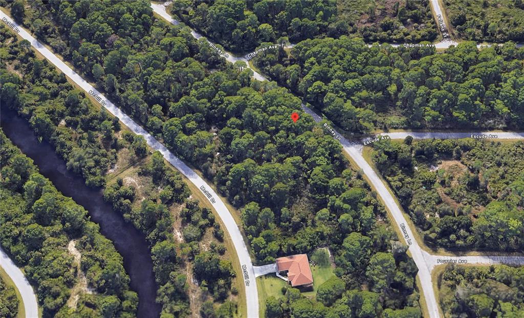 This is an aerial satellite view of a wooded residential lot with surrounding streets — 362 BINNEY LANE, PORT CHARLOTTE, FL