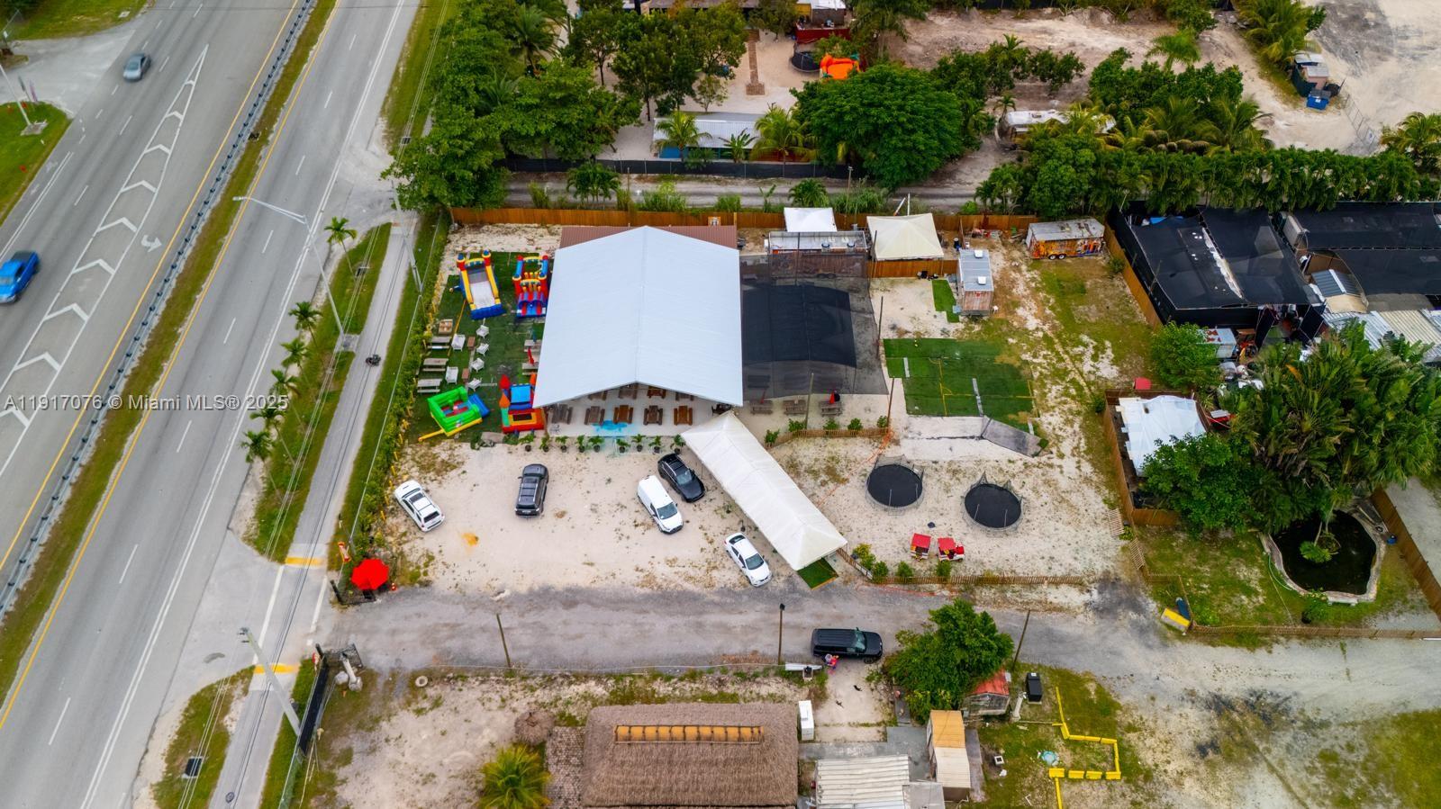 An aerial view shows a large event venue with outdoor play areas and parking — 16860 SW 177TH AVE, Miami FL 33187, MIAMI, FL