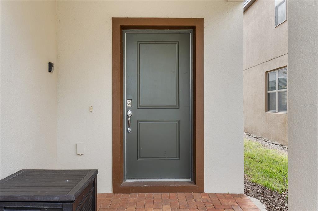 A mudroom area features a white built-in bench with shelving against gray walls — 5505 MISTY OAK CIRCLE, DAVENPORT, FL