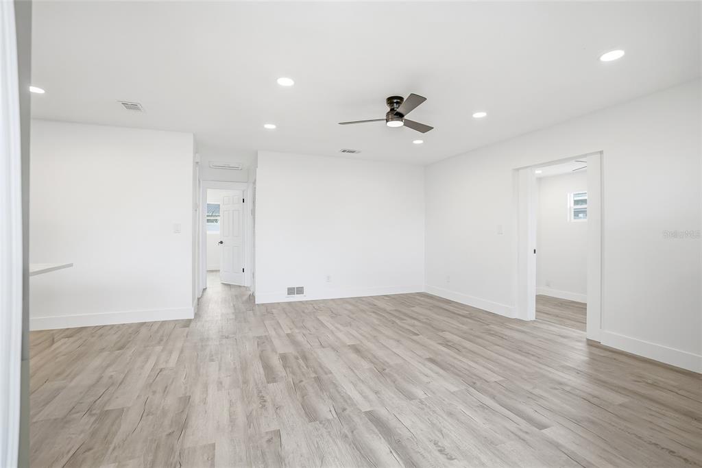 An empty room with white walls, recessed lighting, a ceiling fan, and light wood flooring — 529 FIREFLY LANE, APOLLO BEACH, FL
