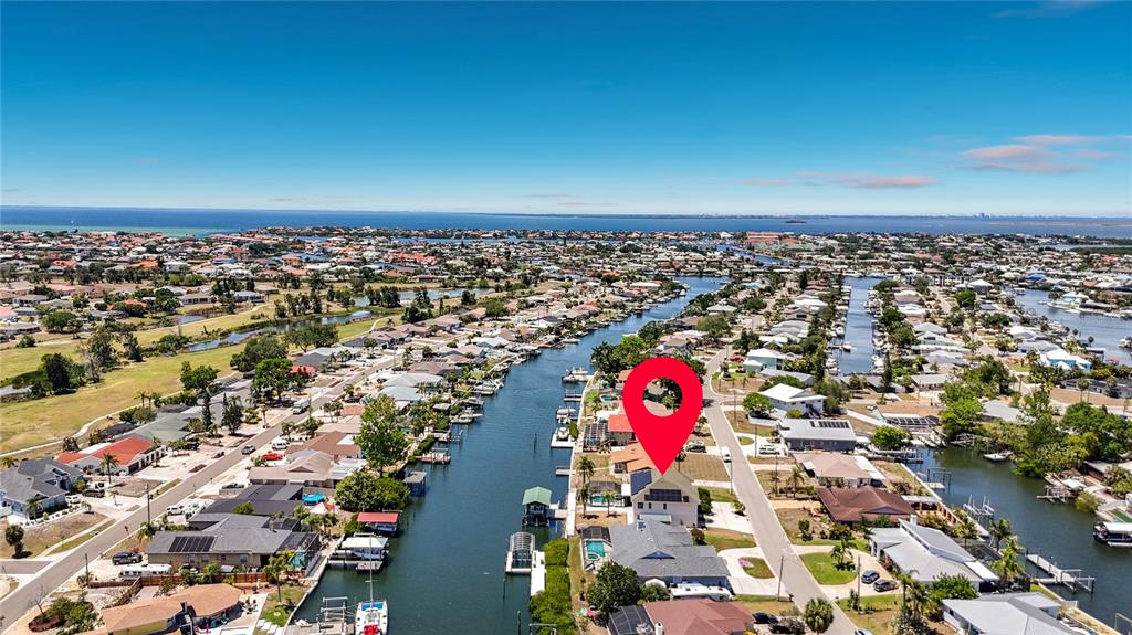 An aerial view shows a waterfront residential neighborhood with a red location pin — 624 KINGSTON COURT, APOLLO BEACH, FL