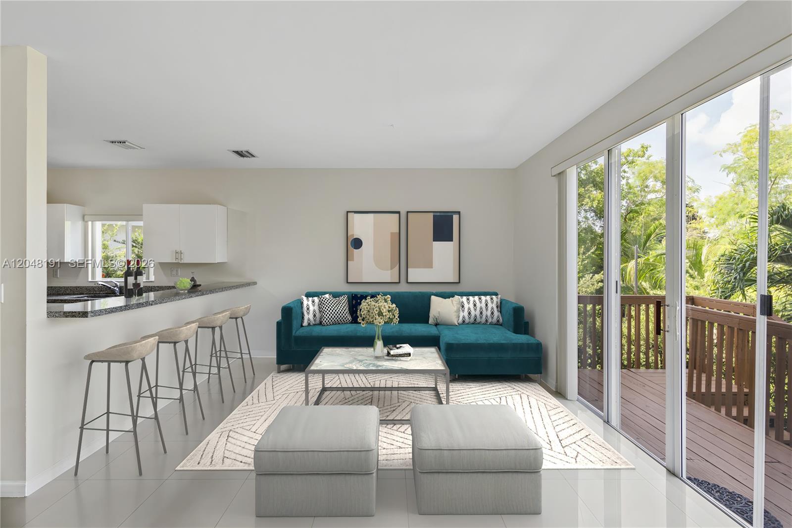 This is a digital rendering of a living room with a teal sectional and kitchen bar — 2782 SW 33rd Ave # 2782, Miami FL 33133, MIAMI, FL