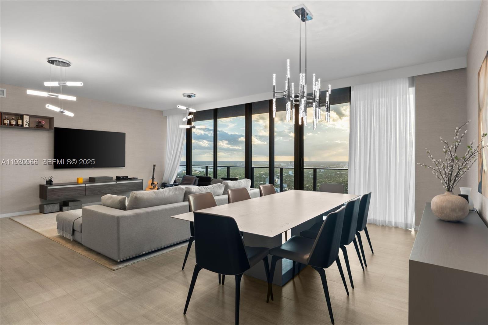 A modern open-concept living and dining area features floor-to-ceiling windows with a city view — 1000 Brickell Plz, Miami FL 33131, MIAMI, FL
