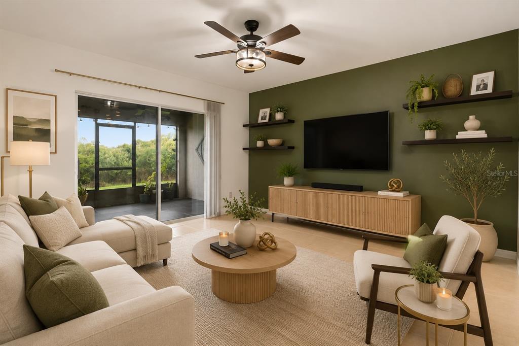 A living room features an olive green accent wall, floating shelves, and a sliding glass door — 322 ANNABELLE WAY, DAVENPORT, FL