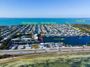 An aerial view of a coastal neighborhood with a marina, beaches, and a highway — 74560 Overseas Highway, Islamorada FL 33036, ISLAMORADA, FL