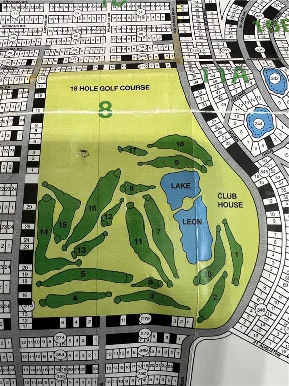 This is a map showing the layout of an 18-hole golf course and surrounding residential lots — 506 MAGNOLIA DRIVE, INDIAN LAKE ESTATES, FL