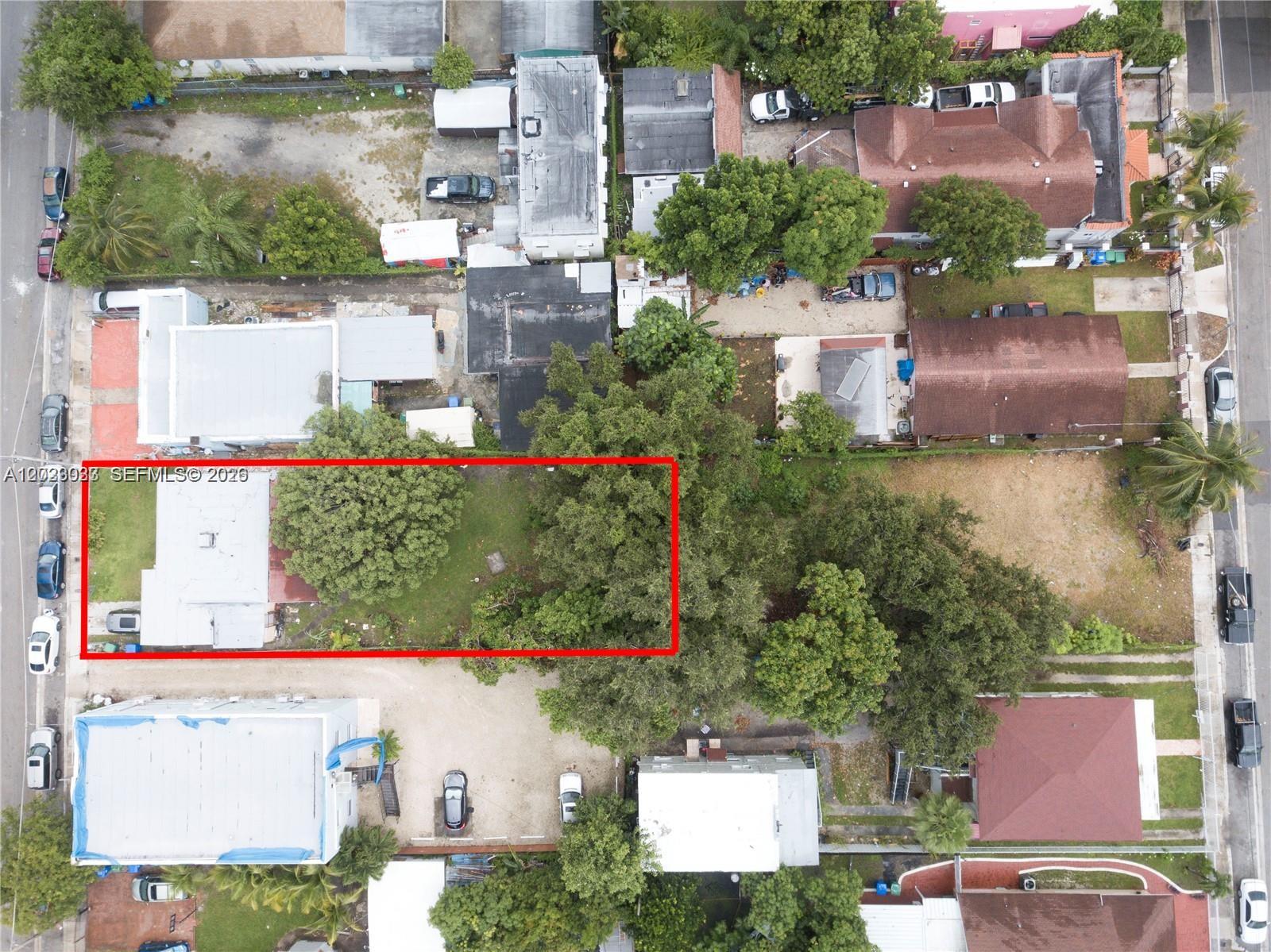 An aerial view shows a residential lot with a house and trees outlined in red — 266 NW 32nd St, Miami FL 33127, MIAMI, FL