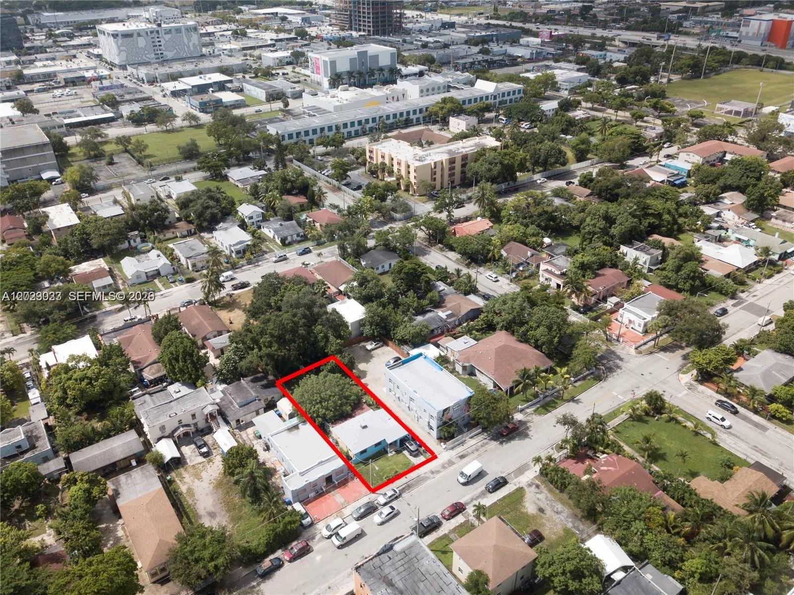 An aerial view shows a single-story house outlined in red within a residential neighborhood — 266 NW 32nd St, Miami FL 33127, MIAMI, FL