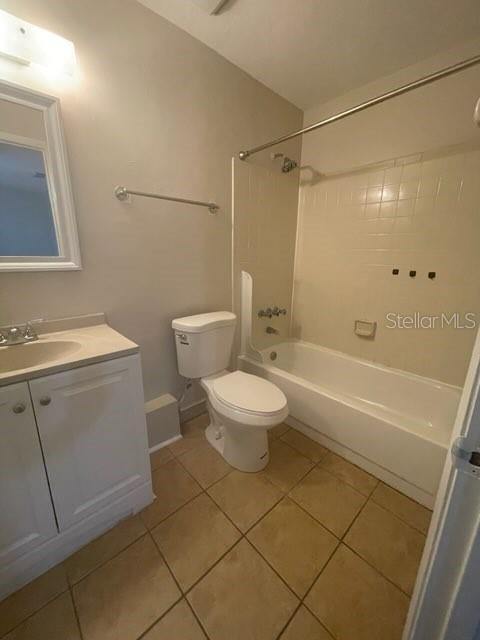 A bathroom features a white vanity, a toilet, and a shower-tub combination with tiled walls — 4411 SW 34TH STREET UNIT 1304, GAINESVILLE, FL