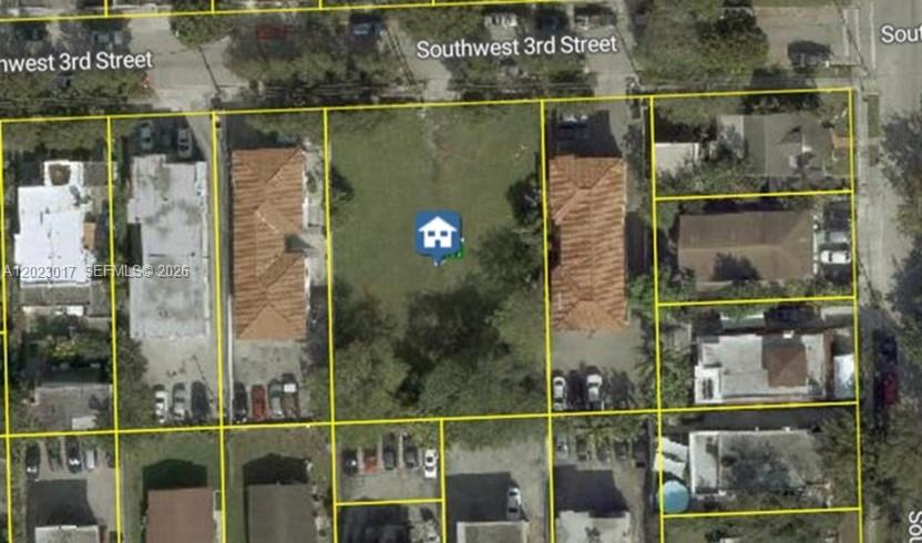An aerial view shows a vacant rectangular lot situated between two existing residential buildings — 240 SW 7th Ave, Miami FL 33130, MIAMI, FL