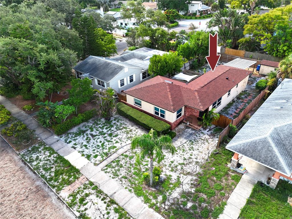 An aerial view shows a single-story house with a red roof and a front yard — 6210 4TH AVENUE S, ST PETERSBURG, FL