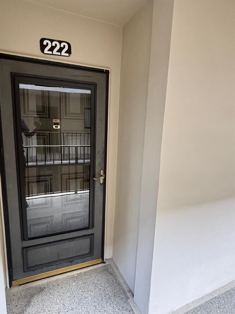 A gray door with a glass panel and the number 222 above it — 5340 Las Verdes Circle # 222, Delray Beach FL 33484, DELRAY BEACH, FL