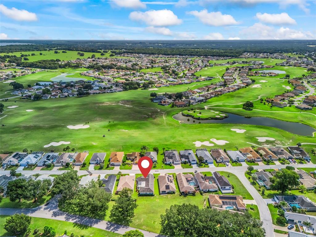 An aerial view shows a residential house with a red location pin on a golf course — 17832 SE 115TH COURT, SUMMERFIELD, FL
