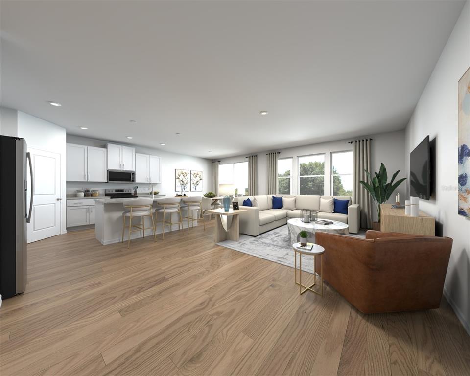 This rendering shows an open-concept kitchen and living room with light wood flooring — 13208 SHELLMORE AVENUE, PALMETTO, FL