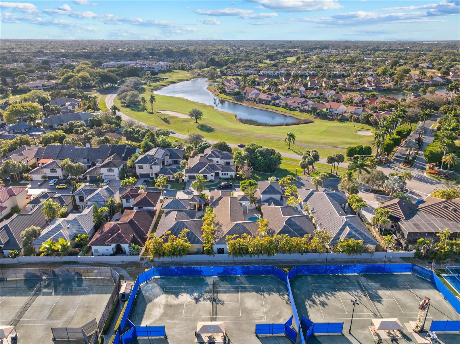 An aerial view shows a residential neighborhood with tennis courts in the foreground — 22722 El Dorado Drive, Boca Raton FL 33433, BOCA RATON, FL