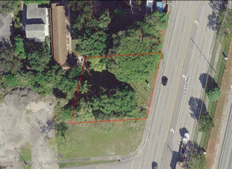 An aerial view shows a vacant, tree-covered lot outlined in red along a highway — 583 S Dixie Highway, Deerfield Beach FL 33441, DEERFIELD BEACH, FL