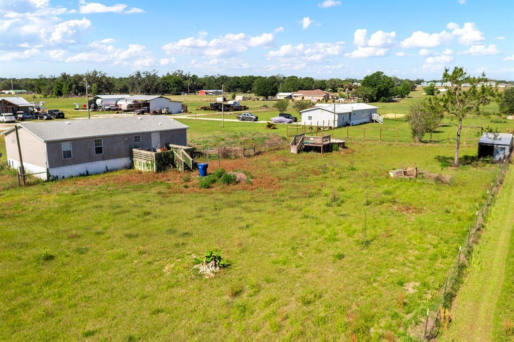 An aerial view shows a rural property with two mobile homes and a small shed — 12011 OLD LAKELAND HIGHWAY, DADE CITY, FL