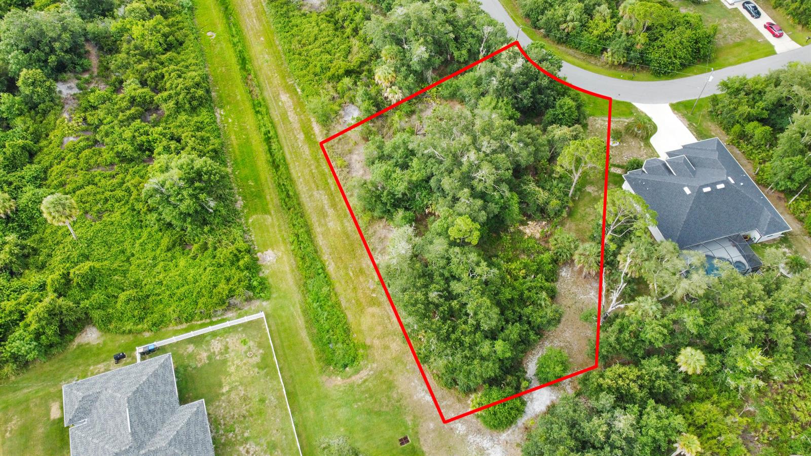 An aerial view shows a wooded, irregularly shaped vacant lot outlined in red — Ancient Ancient, North Port FL 34286, NORTH PORT, FL