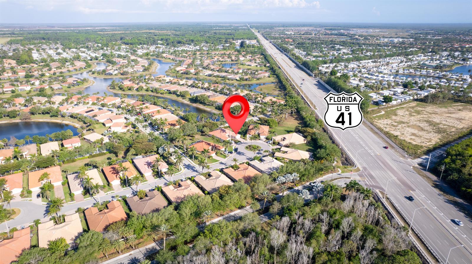 An aerial view shows a residential neighborhood with a red location pin near a highway — 14190 Fall Creek Court, Naples FL 34114, NAPLES, FL