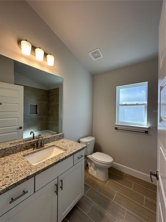 An unfinished hallway with drywall, textured ceilings, and interior doors under construction — 12535 NE 48TH TERRACE, OXFORD, FL