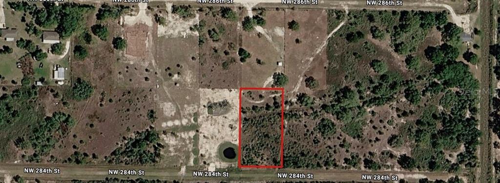 An aerial map shows a rectangular plot of land outlined in red between two streets — 20275 NW 284TH STREET, OKEECHOBEE, FL
