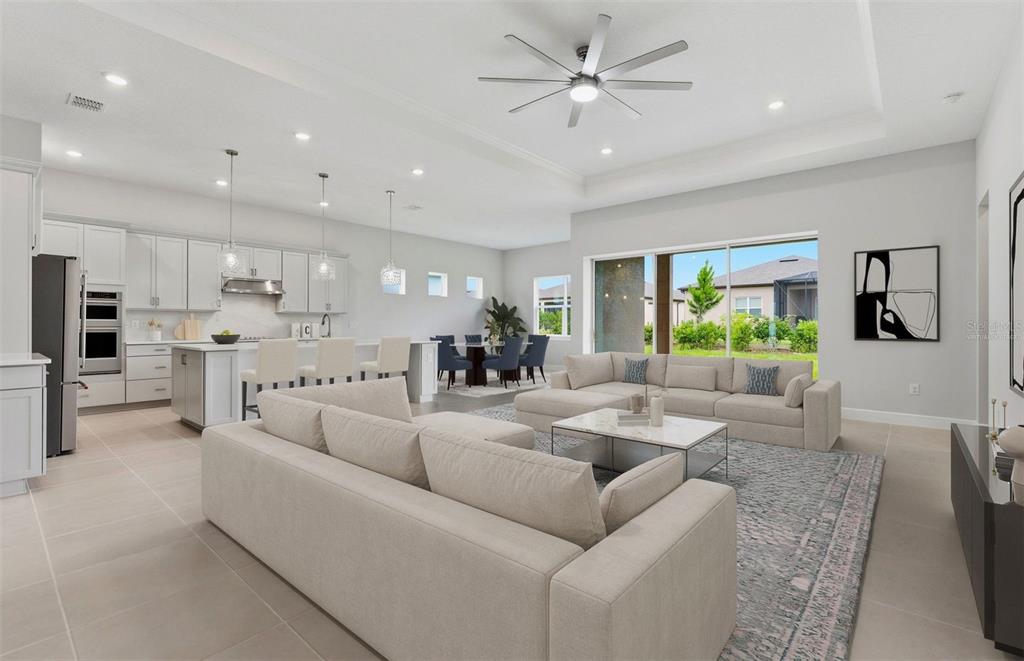 This is a virtual rendering of an open-concept living room and kitchen with neutral decor — 6200 SW 82ND TERRACE ROAD, OCALA, FL