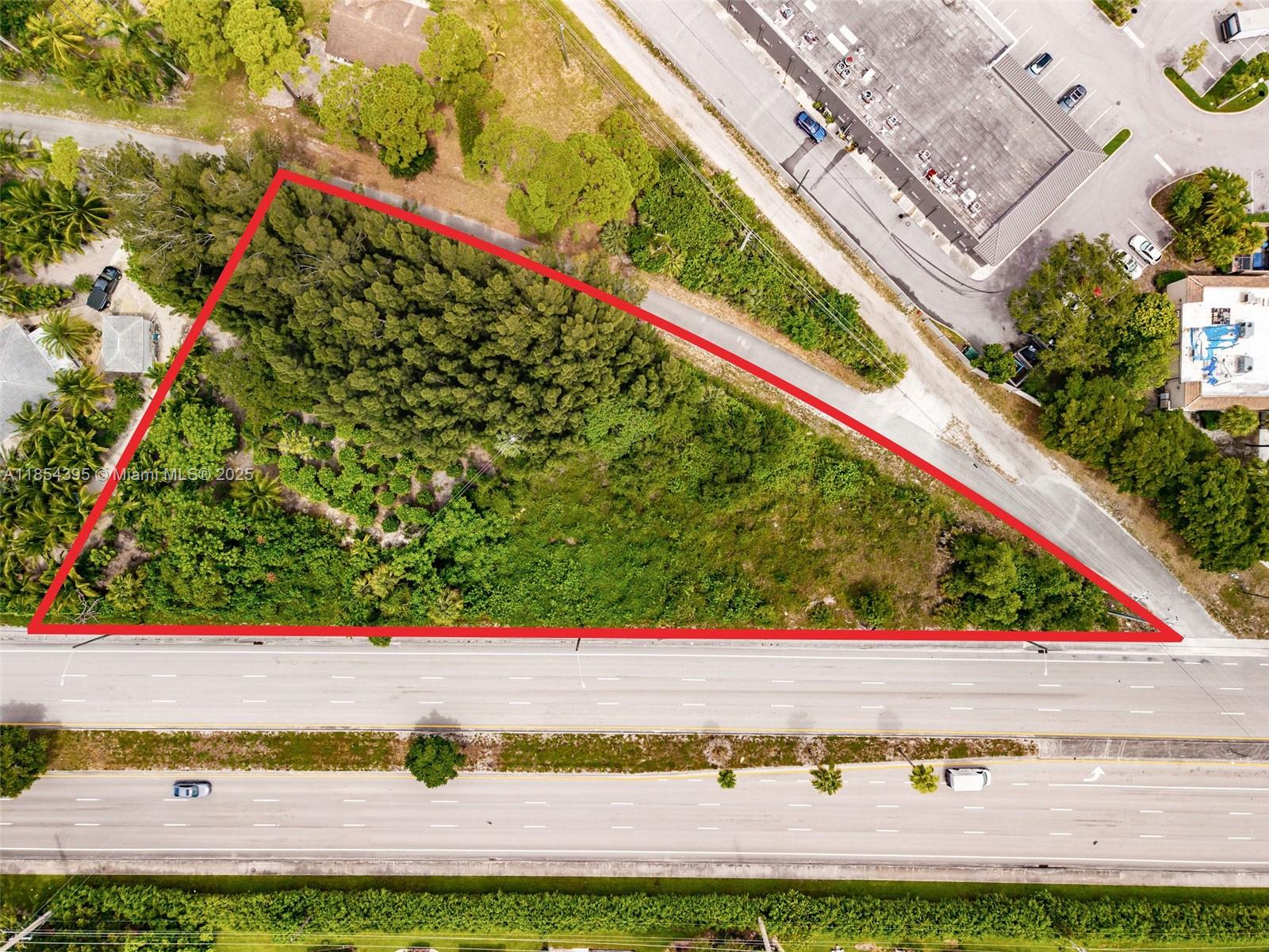 An aerial view shows a triangular, tree-covered vacant lot bordered by a multi-lane highway — 8301 S Military Trl, Boynton Beach FL 33436, BOYNTON BEACH, FL
